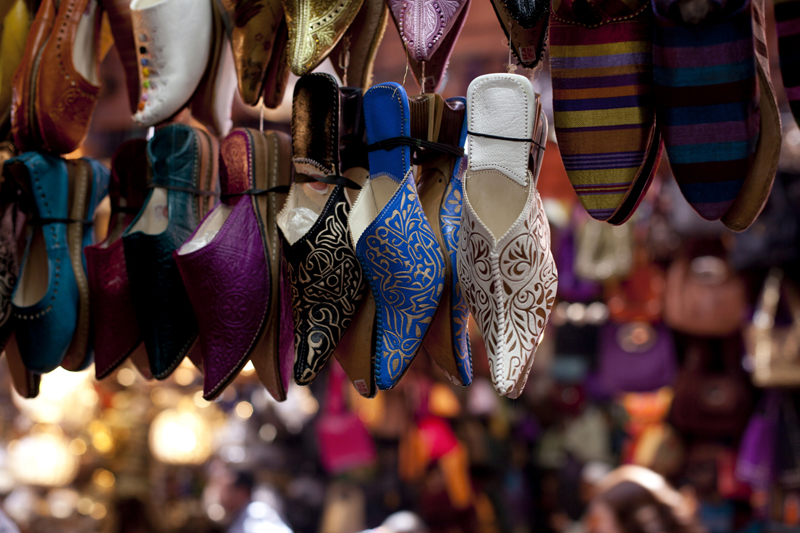 Ornamented traditional moroccan shoes in medina street souk